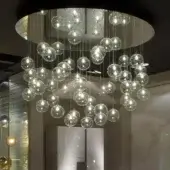 Distinguished Reflex Bulles suspension lamp with clear glass spheres and delicate metal cables in a glossy finish