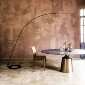 Elegant Cattelan Italia Lampo floor lamp with curved silhouette crafted in embossed lacquered black steel and slender steel wire