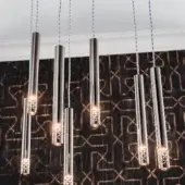 Distinguished Cattelan Italia Stilo suspension lamp crafted in satin bronze steel with a brass-toned cage and twisted cords