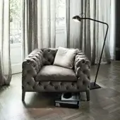 Exceptional Arketipo Windsor lounge chair in dark velvet with diamond quilting and button tufting, built with a discreet wood frame