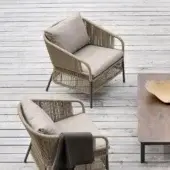 Distinguished Varaschin Cricket lounge chair with hand-woven rope backrest and durable powder-coated aluminum frame in neutral beige textiles