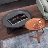 Exclusive Bonaldo Frinfri coffee table with dark gray matte metal and dynamic X-shaped legs supporting an oval tabletop