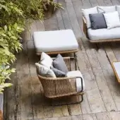Exceptional Varaschin Babylon ottoman with aluminum frame woven in synthetic fiber rope and plush white cushion