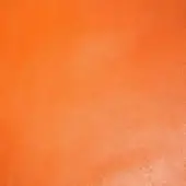 Orange leather texture with a matte finish, displaying a granular surface and subtle tonal variations, suggesting a natural grain and slight wear.
