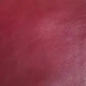 Deep red leather texture sample, “px platano,” shows a subtly pebbled, matte surface with tonal variations and consistent grain throughout.