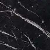 Matt marquinia black marble texture with irregular white and light gray veins, displaying a porous, non-reflective surface and organic patterns.