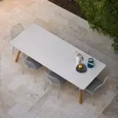 Elegant Varaschin Link table with a light gray tabletop and medium brown wood legs crafted in powder-coated aluminum