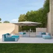 Exceptional Varaschin Belt sectional with a solid okumé wood structure and color-blocked light beige with vibrant teal blue textiles