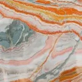 Tangerine onyx marble slab displaying concentric bands of orange, peach, white, and gray-blue with polished and fractured textures.