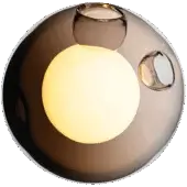 Bocci 28 wall sconce, grey glass sphere, features illuminated inner bulb and brushed nickel mounts against olive green.