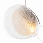 Glass pendant light, clear finish, ovoid shape with textured metallic interior and minimalist suspension wires, studio shot.