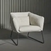 Elegant Bonaldo Nikos low lounge chair in textured beige fabric with a sleek dark metal sled base and matte finish