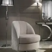 Distinguished DV Home Collection Charlotte lounge chair with neutral beige quilted fabric and shining stainless steel circular base