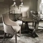 Distinguished DV Home Collection Byron armchair with neutral beige fabric upholstery and sleek stainless steel legs