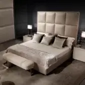 Exclusive DV Home Collection Duke bed with neutral beige fabric upholstery, quilted headboard and matte finish