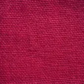 Red lino stone washed fabric texture displaying a dense, nubby weave with dye variations, erba fabrics collection 33.