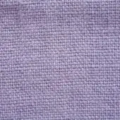 Lavender linen fabric texture with a stone-washed finish and visible weave, displaying a heathered effect and printed label detail.