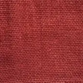 Stone washed linen fabric texture in terracotta, displaying a tight weave and granular surface with subtle tonal shifts and matte finish.