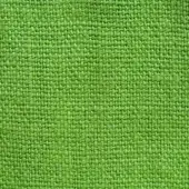 Stone-washed linen fabric texture, verde chiaro color, dense weave with small knots, matte finish, natural textile appearance.