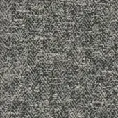Herringbone fabric sample in gray and off-white tones displays a dense, textured weave with subtle yarn variations and a visible brand label.