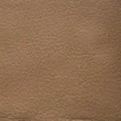 Leather texture sample, tan pebble-grain, matte finish, displaying subtle tonal variations and a dense network of irregular bumps and creases.