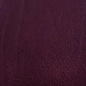 Bordeaux leather texture displaying a crystalline grain, matte finish, and subtle tonal variations for depth and a natural, durable appearance.