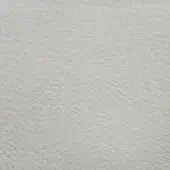 Light gray pebble-grain leather texture sample on white, displaying a dense, irregular pattern and matte crema finish, labeled “erba crystal.”