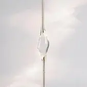 Gold sculpture with translucent gel, slender elongated form, pink to gray gradient, and integrated text “il pezzo mancante > il pezzo > gold”.