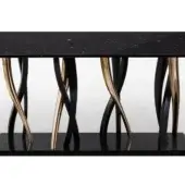 Console table, black marquina marble top, burnished gold intertwined base with lower shelf, modern sculptural design, neutral gray backdrop.