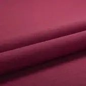 Burgundy knit fabric swatch, diagonally folded, displays a smooth matte texture and consistent color, identified as lacividina tailor copertina.