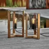 Sophisticated Royal Botania Tristar floor lamp with teak wood frame and smoked glass lampshade crafted for inviting outdoor lighting