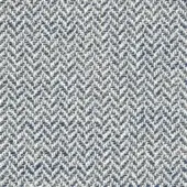 Herringbone fabric sample in white, blue, and beige tones displays a dense, nubby texture with a repeating chevron motif and subtle directional flow.