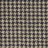 Beige brown floral fabric sample with repeating four-petaled motifs, dark gray-blue background, textured matte weave, MDF Italia collection.