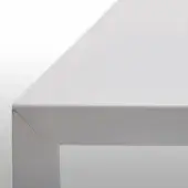 White MDF italia table corner displaying a matte, painted finish and rectangular leg, highlighting material texture and modern design.