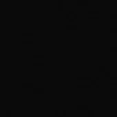 Matte black material sample displaying a granular texture, with “mdf italia” text overlay in gray, indicating a mass pigmented finish X113a.