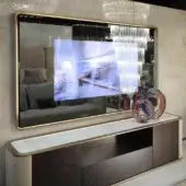 Exclusive Reflex Oh Frame TV mirror with Supersilver glass within a shaped wood frame and polished brass tone finish