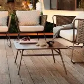 Elegant Roberti Rattan Portofino coffee table with aluminum base and CORTEN finish high-pressure laminate tabletop