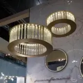 Exceptional Reflex Comete suspension lamp with transparent glass elements and a glossy golden metal framework