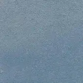 Blue fabric texture with granular weave, matte finish, and tonal variations; slight surface irregularities and a dark speck are visible.