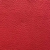 Red pebble-grain leather texture, “rosso 9l” Presotto collection, smooth consistent surface with rounded indentations, durable upholstery material.