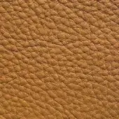 Golden-brown pebble-grain leather texture, dense packed grain with subtle tonal variations, durable upholstery material, Presotto “New Heavy” XTHY43044.