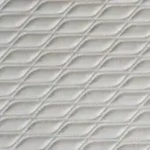 Quilted textile sample in light beige features diagonal, undulating lines forming a chevron motif with fine stitching and a matte finish.