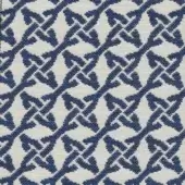 Navy blue and cream geometric textile with woven floral motifs and diagonal lines; Kristal Blu fabric from the Roberti Rattan collection.