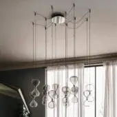 Distinguished Cattelan Italia Sablier suspension lamp in clear glass with dark-toned metal, exhibiting an organic asymmetrical form and gradient effects
