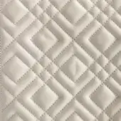 Rugiano Elle rug, light beige leather, diamond quilted pattern with textured surface and tonal stitching, indoor embroidery design.