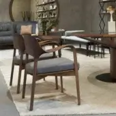 Distinguished Porada Ella armchair with solid Canaletto walnut frame and sophisticated gray fabric upholstery with satin finish