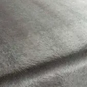 Gray Rugiano rug with dense, sheared texture and short pile, displaying subtle tonal variations and a gently curved, folded shape.