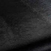 Dark gray rug with swirling, concentric ridges and a looped pile texture, showcasing subtle tonal variations in a diffused light.