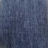 Dark blue textured rug with dense weave and vertical ribbing, heathered navy tone, nubby surface suggesting wool or blend material.