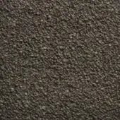 Dark gray textured rug with granular surface composed of irregular particles, displaying subtle tonal variations under diffused studio lighting.